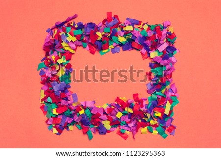 Festive party decor and confetti on pink background