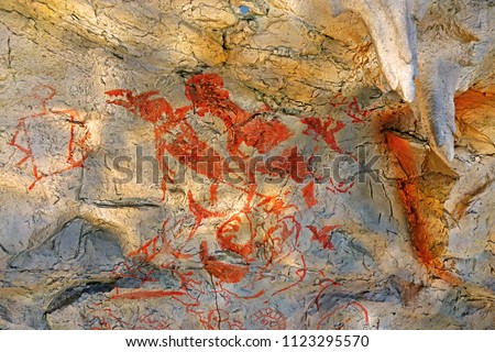 Cave paintings(Parietal art), prehistoric art on cave walls and ceilings of Pee huo toe cave, Krabi province Thailand.