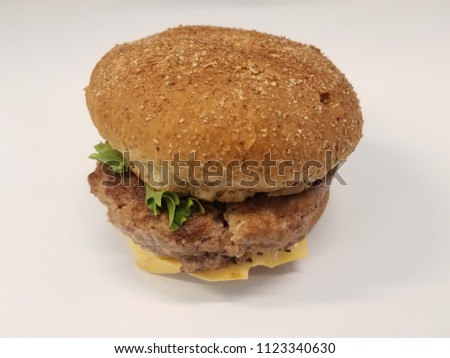 turkey burger with cheese and greens