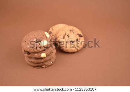 Chocolate Cookies stock images. Cookies on a brown background. Biscuit on a brown background with copy space for text