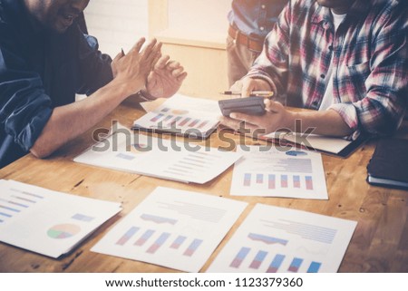 Business team financial inspector and secretary making report, calculating or checking balance, Audit concept at working with plan and analyzing investment charts at his workplace.