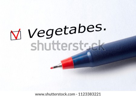 The word vegetables is printed on a white background. Check mark in red, marked in the square.