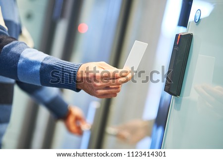 using electronic card key for access Royalty-Free Stock Photo #1123414301