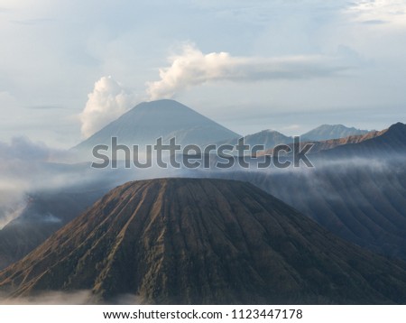 INDONESIA - Bromo Mountain is an active volcano. Landscape view of Bromo mountain with fog around the valley from Penanjakan viewpoint at Bromo Tengger Semeru National Park , East Java, november, 2017