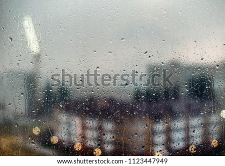 A view of the city through raindrops on the window