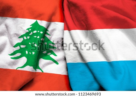 Lebanon and Luxembourg flag on cloth texture