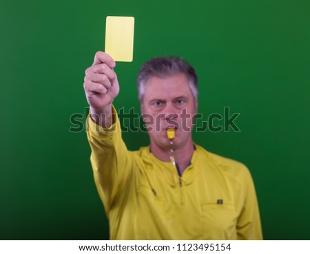 soccer referee giving the yellow  card isolated