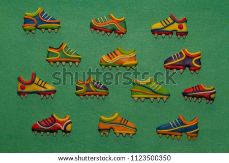 Big set of cartoon soccer shoes. Children's football symbols and icons. Football championship pattern.