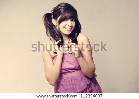 Beautiful teenager girl posing in studio