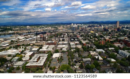 Downtown Portland Oregon ABC district and pearl district with the willamette river under Fremont Bridge aerial panorama of a perfect summer day