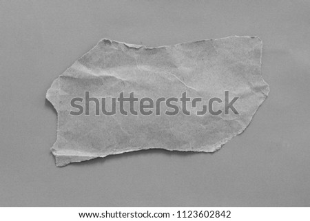 torn paper on gray background with copy space for text