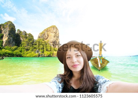Happy traveler woman on sand beach krabi the famous place landscape island ,krabi thailand.Outdoor vacatrip