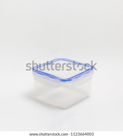 Studio photography of a translucent plastic box on isolated white background. Royalty-Free Stock Photo #1123664003