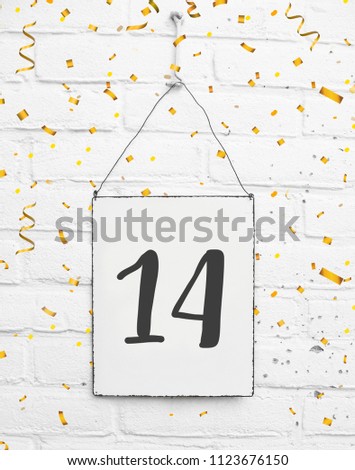14 years old birthday party card text with golden confetti, number fourteen, metal plate white brick background