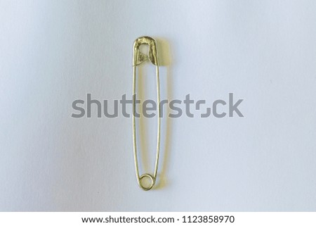 Large Aluminum Bracelet On a white background Used for stitching together fabric. Without sewing