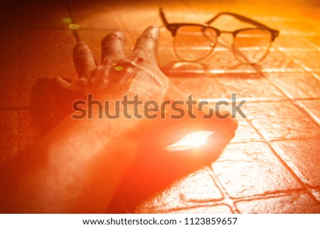 Hand laying on floor is stretching to reach for light and glasses. This can be applied for all illustration and printing.