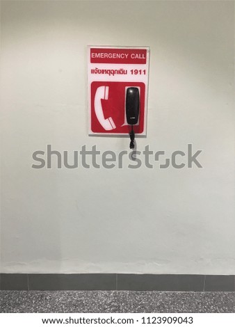emergency call signage with description in Thai 