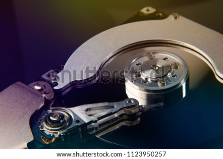 inside of hard disc or PC disc drive, close up or macro photography of hard drive show cylinder