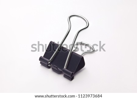 black papper clip  Royalty-Free Stock Photo #1123973684