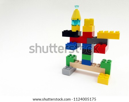 Example of creating a robot from creative plastic brick toys educational for kid isolated on white background. 
