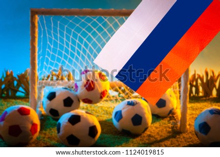 Flag of Russia at the football stadium. Football. Flag of Russia on the background of footballs.