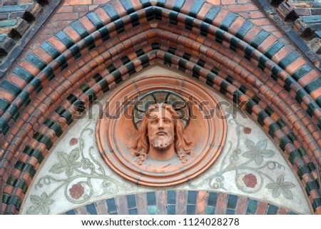 Bas-relief Jesus Christ on the old brick church. 