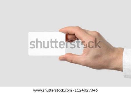 Mockup of male hand holding a Business Card isolated on light grey background. Rounded corner, Europe standard size 85×55 mm.