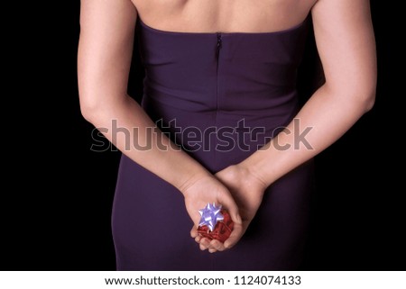 an image of a woman holding a giftbox