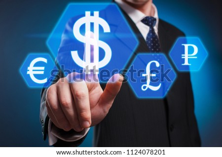 Dolar. The man in a suit and tie clicks the dolar with his index finger on the virtual screen. Exchange. Virtual multimedia display.