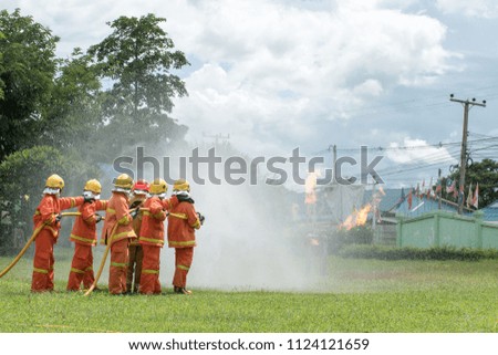 Firefighters Practice a fire drill 