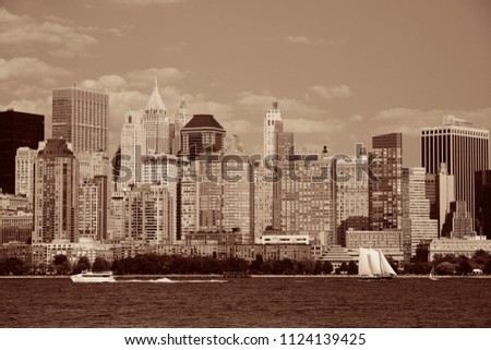 Manhattan downtown skyline with urban skyscrapers over Hudson River.