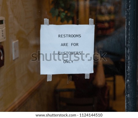 sign says that restrooms are for customers only