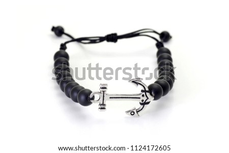 Black onyx bracelet with silver anchor symbol on white