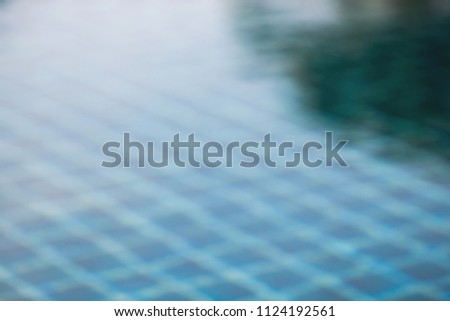 The smooth natural blue water background with bokeh  abstract,vintage and soft colored blur.