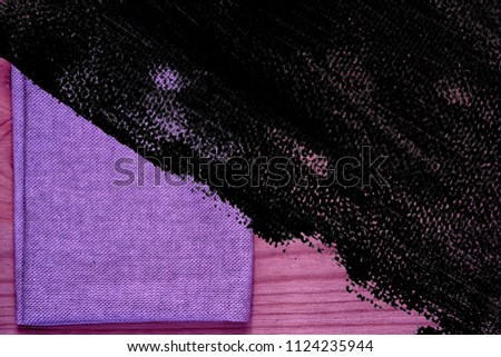 Ultra purple Postcard sample, linen fabric surface on wooden table with free copyspace for greeting text, for mock-up or designer use, book cover sample.
