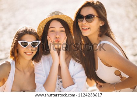 Three women happy at the beach