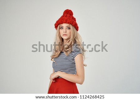   stylish blonde woman in a red fashion hat                             