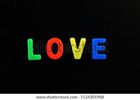English letters in black background are the words education, glowing, white, red, style, collection love