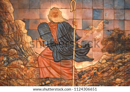 Moses was a prophet in the Abrahamic religions. According to the Hebrew Bible, he was adopted by an Egyptian princess, and later in life became the leader of the Israelites and lawgiver Royalty-Free Stock Photo #1124306651