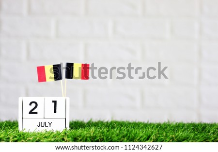 July 21 Wooden calendar and Belgium Flag Concept Belgium national day with space for your text