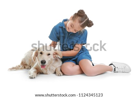 Cute little child with her pet on white background