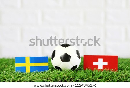ball with Sweden VS Switzerland flag match on Green grass football 2018
