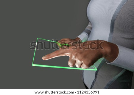 Female hands holding blank futuristic transparent digital tablet pc computer with copy space