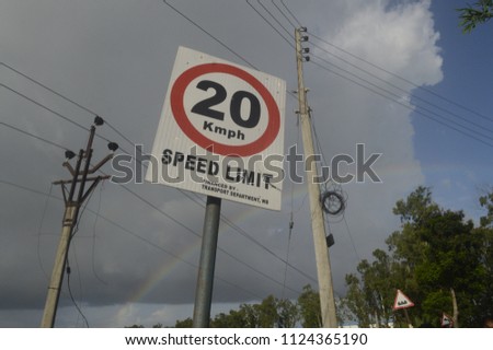 Road travel sign board and sky ranbow