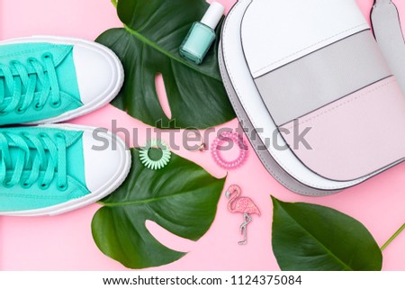 Bright summer accessories on a pink background. Flat lay