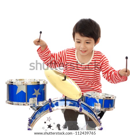 Asian young boy playing blue drum on white background