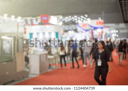 Blurred business people at a trade fair