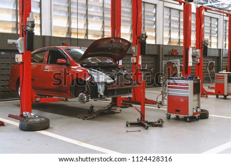 car repair station with soft-focus and over light in the background Royalty-Free Stock Photo #1124428316
