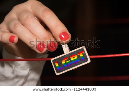 A young, lesbian woman and a symbol for LGBT Lesbian Gay Bisexual Transgender