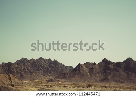 Desert Mountain - Post-production added grain and effects Royalty-Free Stock Photo #112445471
